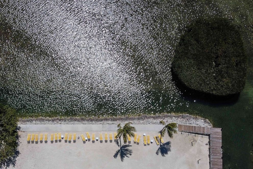 PHOTO: Chairs line a deserted beach resort in Windley Key, some 70 miles south of Miami, on March 22, 2020, during the coronavirus (COVID-19) outbreak.