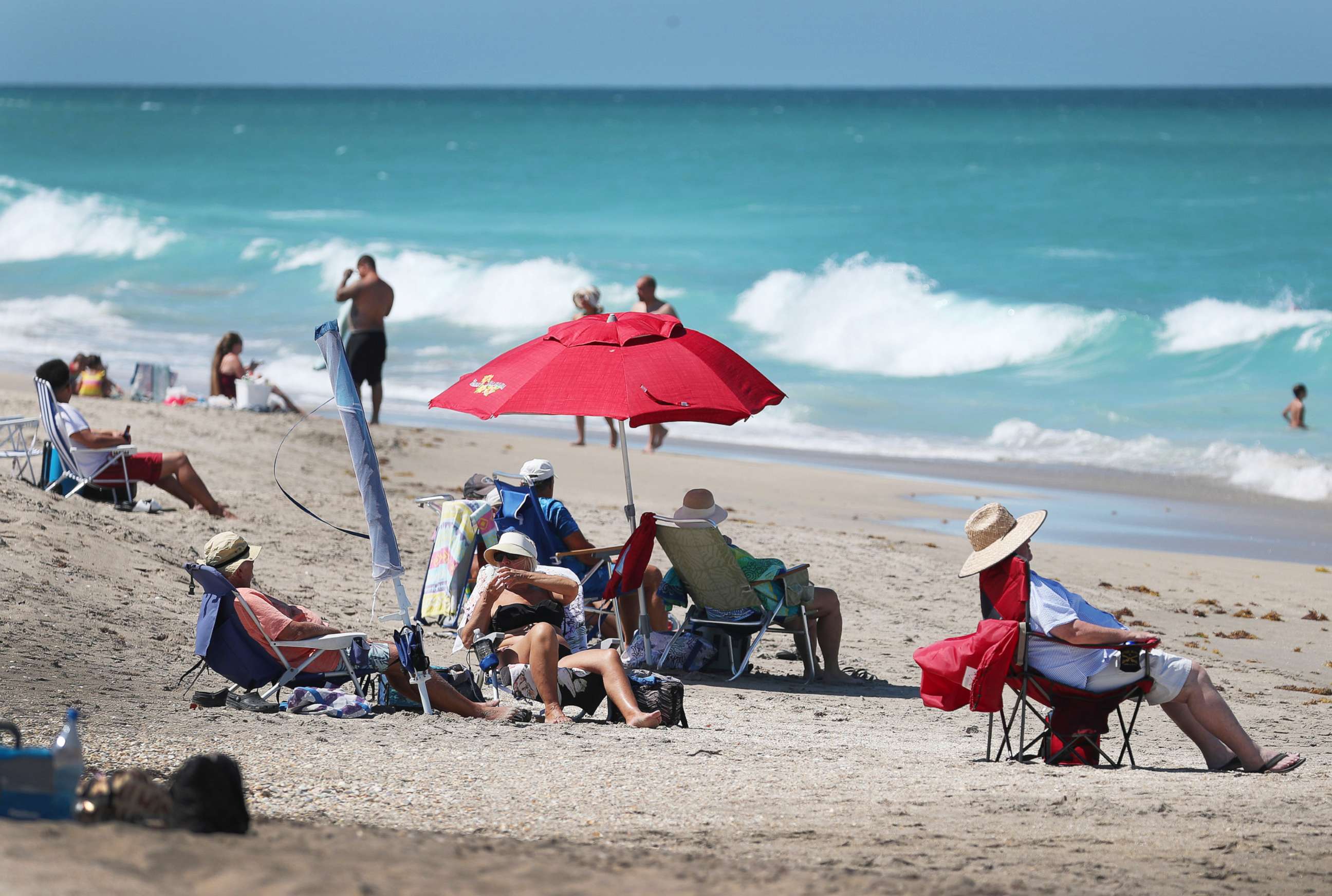 PHOTO: People enjoy the weather, on May 04, 2020, in Jensen Beach, Fla. Restaurants, retailers, as well as beaches and some state parks reopened May 4 with caveats, as the state continues to ease restrictions put in place to contain COVID-19. 