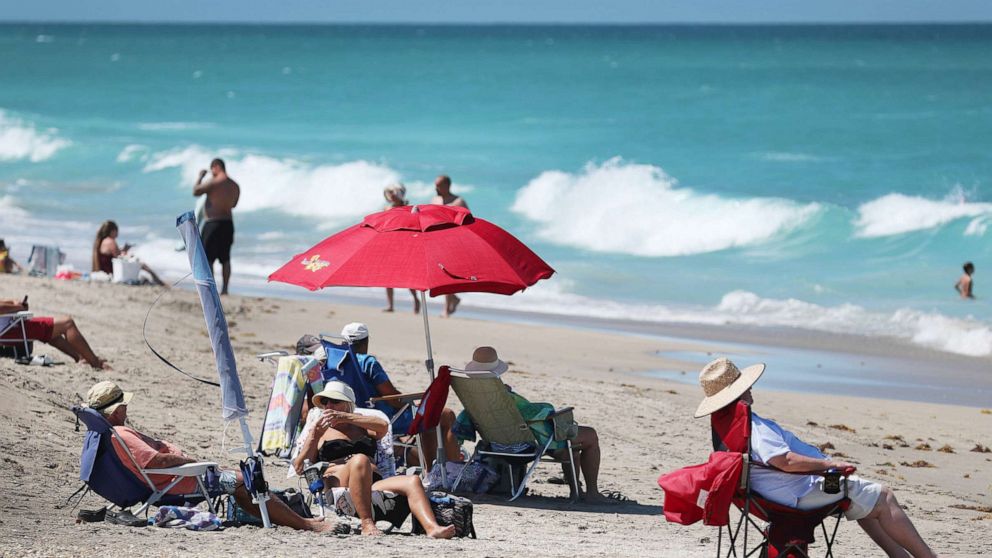 PHOTO: People enjoy the weather, on May 04, 2020, in Jensen Beach, Fla. Restaurants, retailers, as well as beaches and some state parks reopened May 4 with caveats, as the state continues to ease restrictions put in place to contain COVID-19. 
