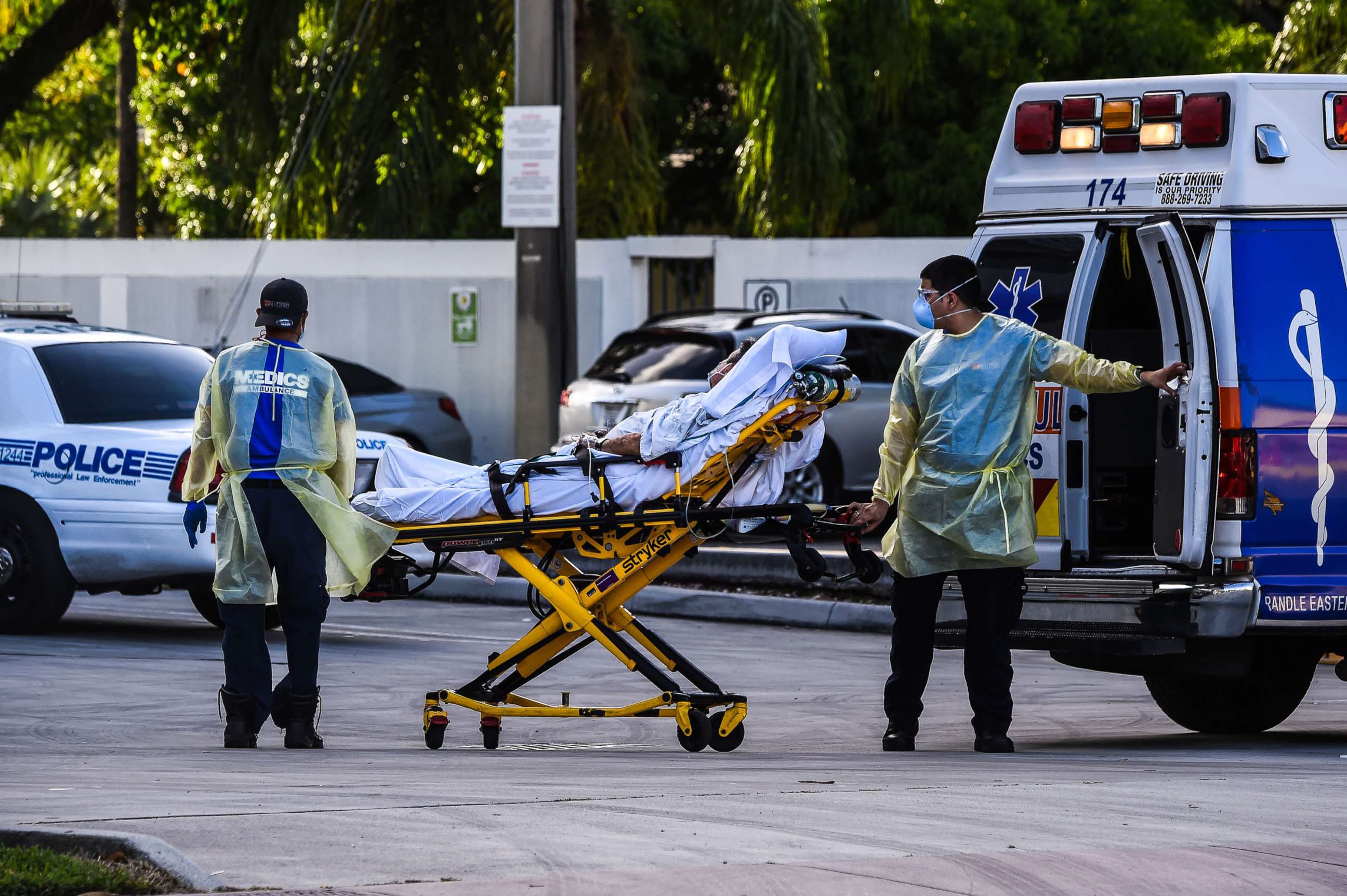 PHOTO: Medics transfer a patient on a stretcher from an ambulance outside of Emergency at Coral Gables Hospital where Coronavirus patients are treated in Coral Gables, Fla., near Miami, on July 30, 2020.