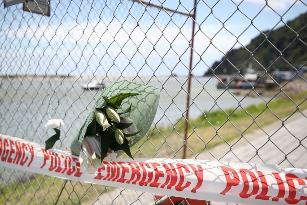 PHOTO: Floral tributes are placed on a fence at the Whakatane Wharf in Whakatane, New Zealand, Dec. 10, 2019. At least six people are dead and several others are missing following volcanic eruptions on White Island on Dec. 9, 2019.