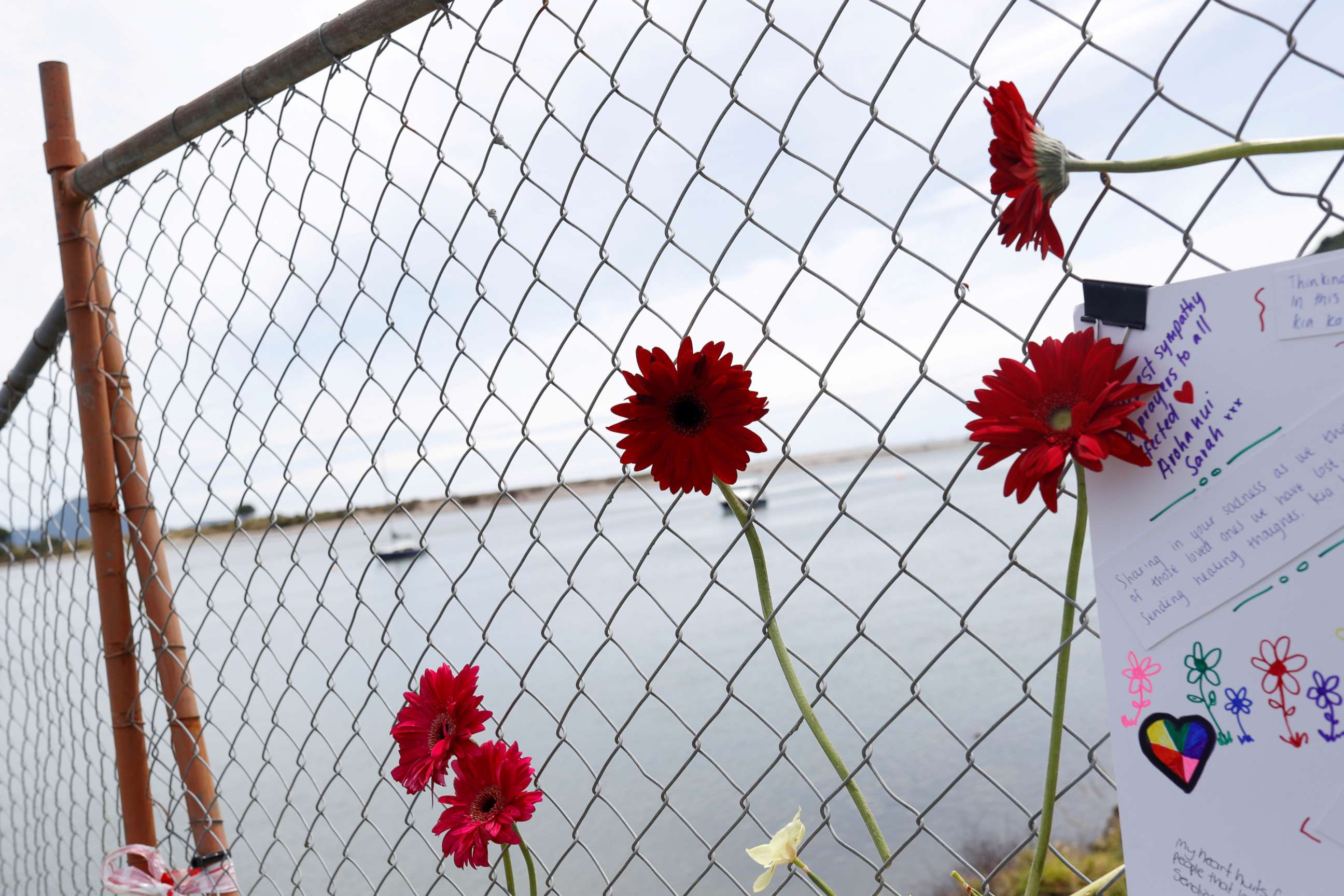 FILE PHOTO: Flowers are seen at a memorial at the harbor in Whakatane, Newzealand, on Dec. 11, 2019, following the volcanic eruption on White Island.