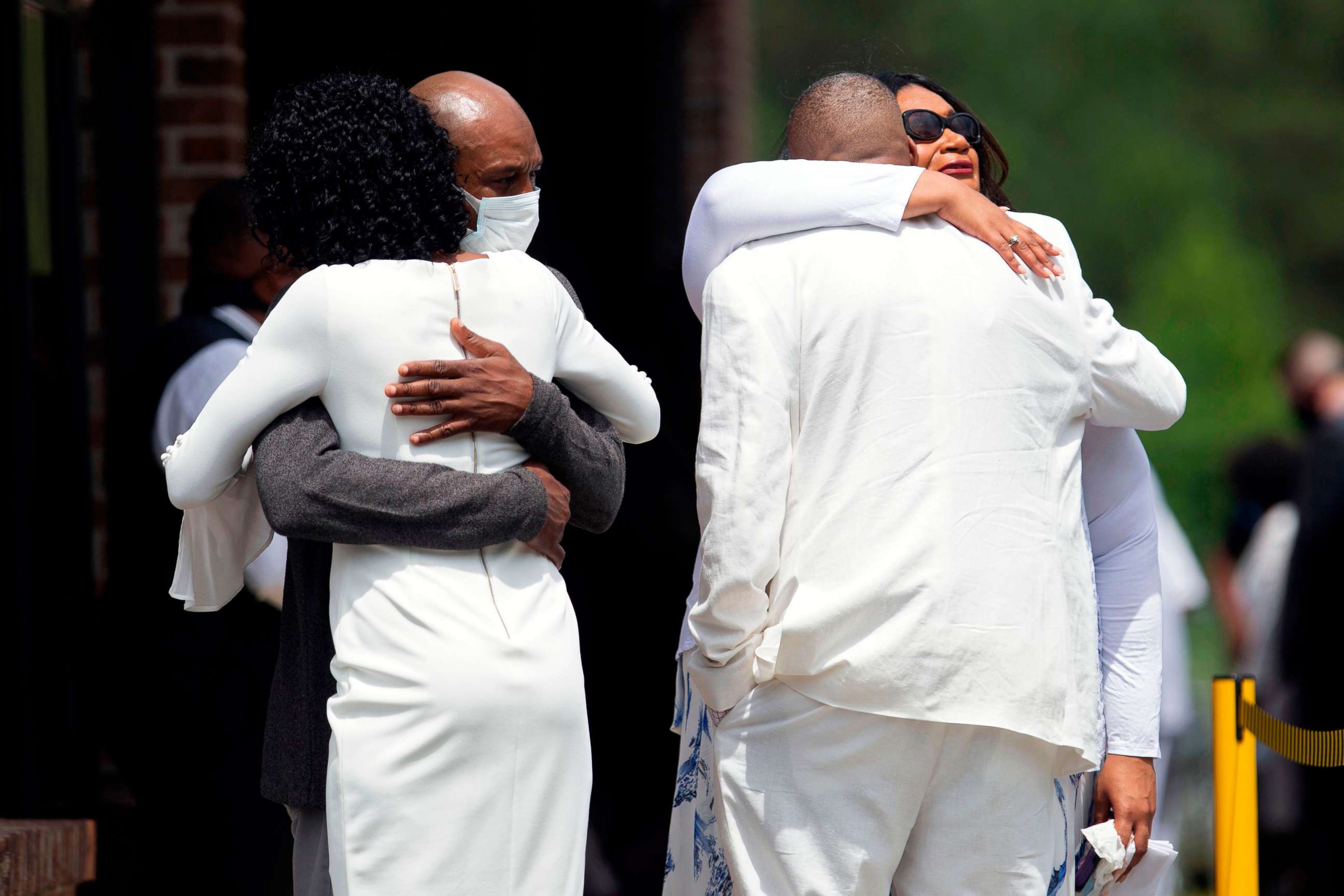 PHOTO: Zsa-Zsa, left, and LaTonya Floyd, sisters of George Floyd, are embraced by family at the private viewing and memorial service outside the Cape Fear Conference B Church in Raeford, N.C., June 6, 2020, during a memorial for George Floyd.
