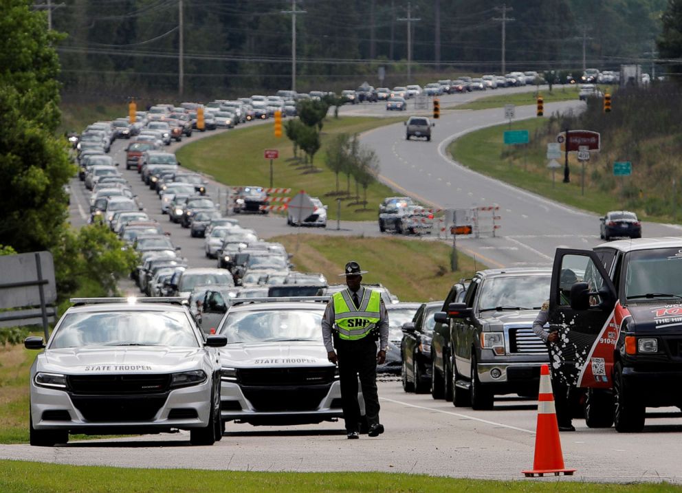 PHOTO: Hundreds of cars line up as mourners arrive for the public viewing of George Floyd, who died in police custody in Minneapolis, in the town where he was born in Raeford, North Caroline, June 6, 2020.