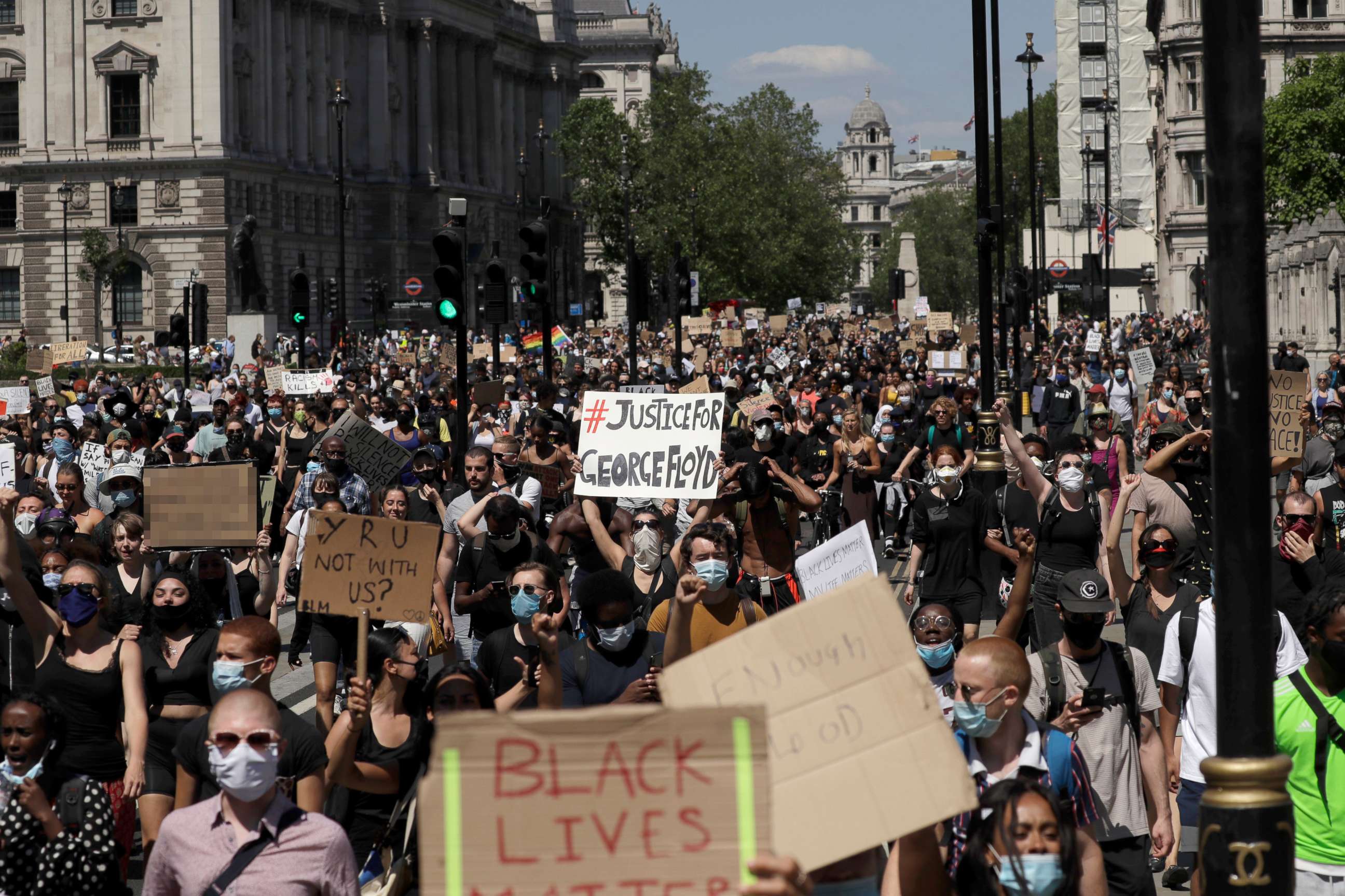 PHOTO: People march through Parliament Square in central London, May 31, 2020, to protest against the recent killing of George Floyd by police officers in Minneapolis.