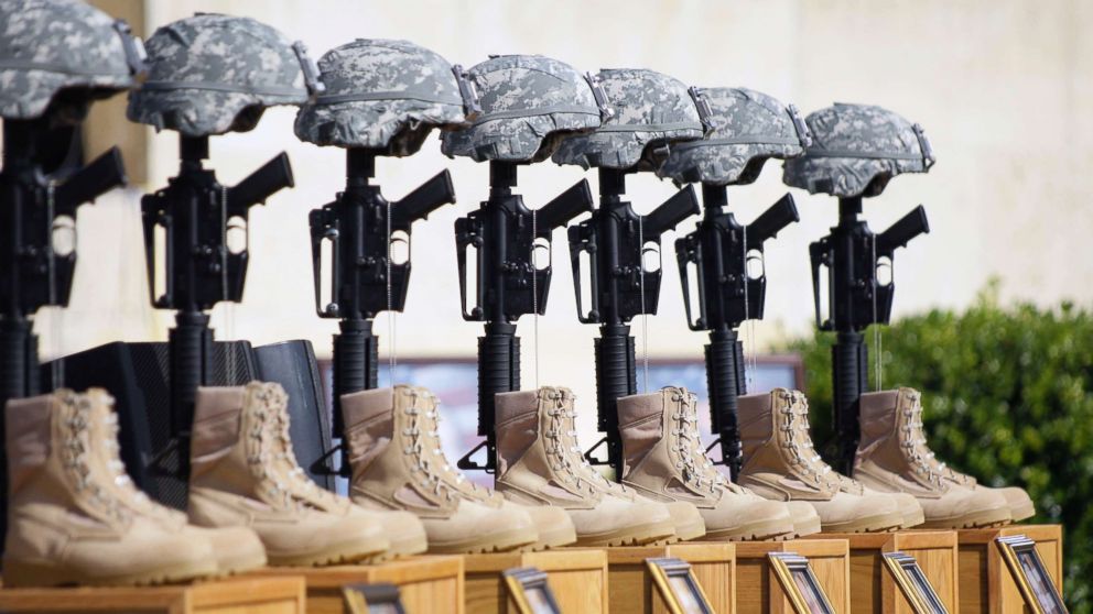 A memorial to victims of the Fort Hood shooting is shown before the start of a memorial service attended by President Barack Obama, Nov. 10, 2009, at Fort Hood, Texas.