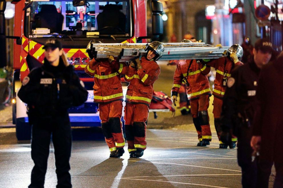 PHOTO: Firefighters carry a ladder near a building that caught fire in Paris, Feb. 5, 2019. 