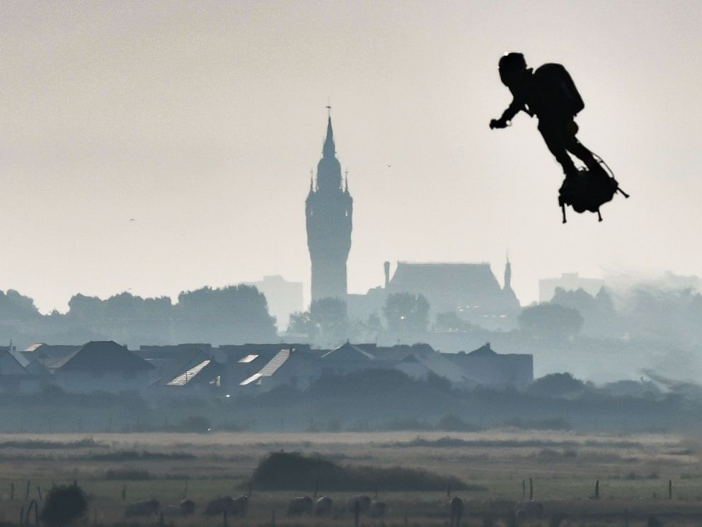 PHOTO: Franky Zapata on his jet-powered flyboard flies past the belfry of the city hall of Calais after he took off from Sangatte, northern France, on Aug. 4, 2019, during his attempt to fly across the 22-mile English Channel crossing in 20 minutes.