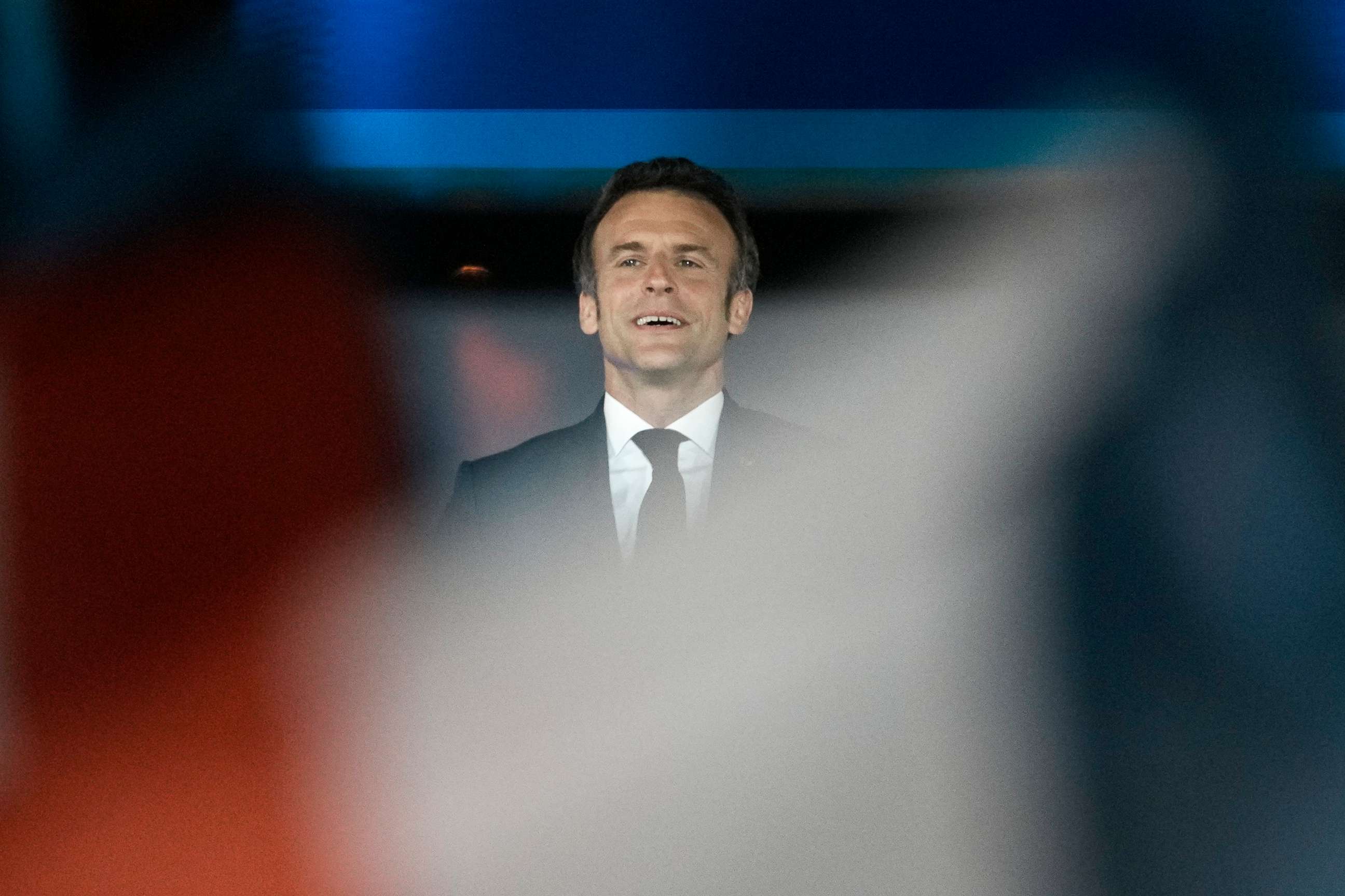 PHOTO: French President Emmanuel Macron celebrates with cheering supporters in Paris, April 24, 2022. 