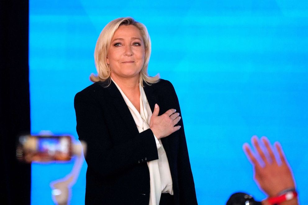 PHOTO: Far-right leader Marine Le Pen gestures as she arrives to speak after the early result projections of the French presidential election runoff were announced in Paris, April 24, 2022.