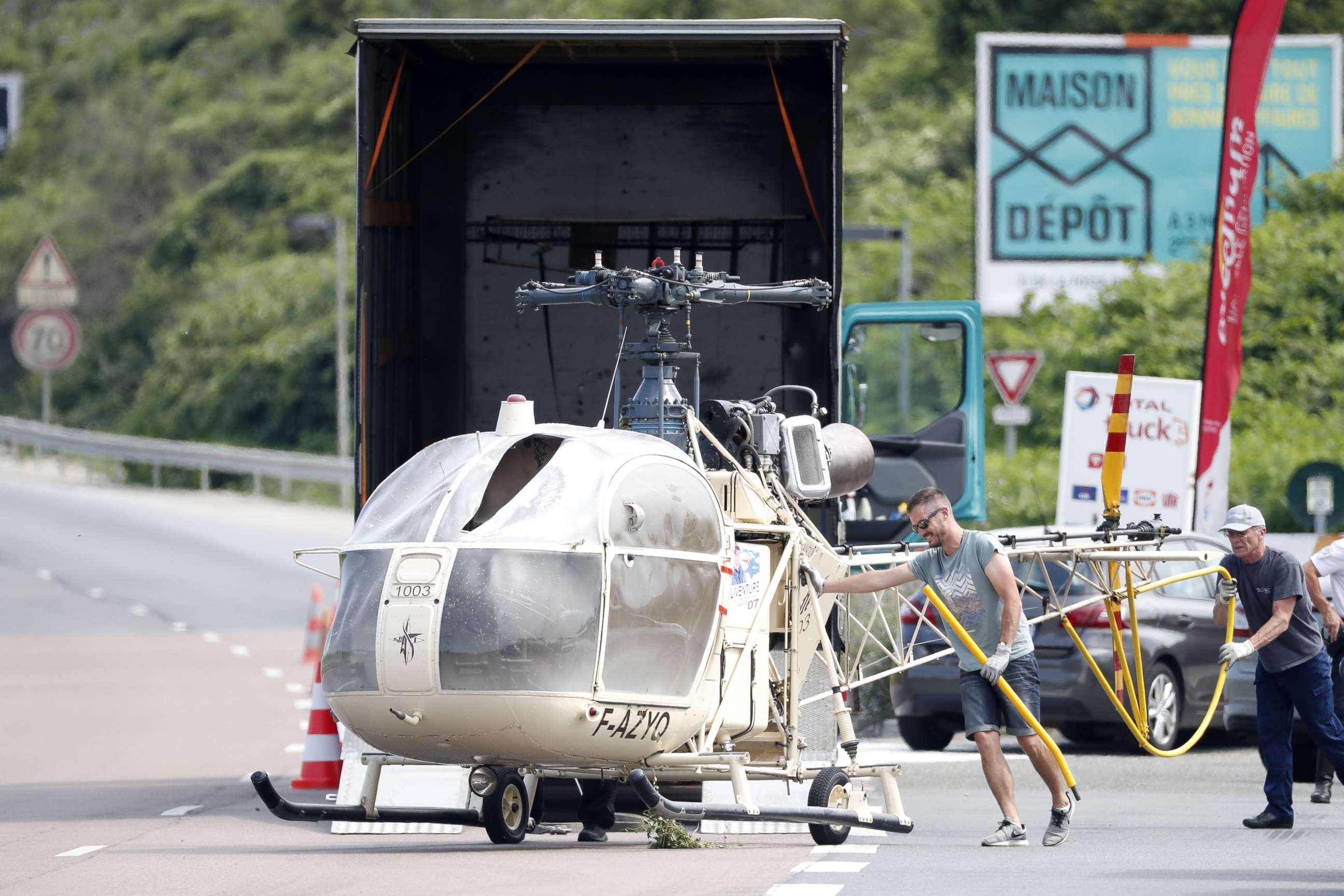 PHOTO: Investigators trasnport an Alouette II helicopter allegedly abandoned by French prisoner Redoine Faid and suspected accomplices after his escape from the prison of Reau, in Gonesse, north of Paris, July 1, 2018.