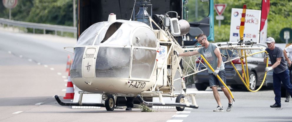 PHOTO: Investigators 
trasnport an Alouette II helicopter allegedly abandoned by French prisoner Redoine Faid and suspected accomplices after his escape from the prison of Reau, in Gonesse, north of 
Paris, July 1, 2018.