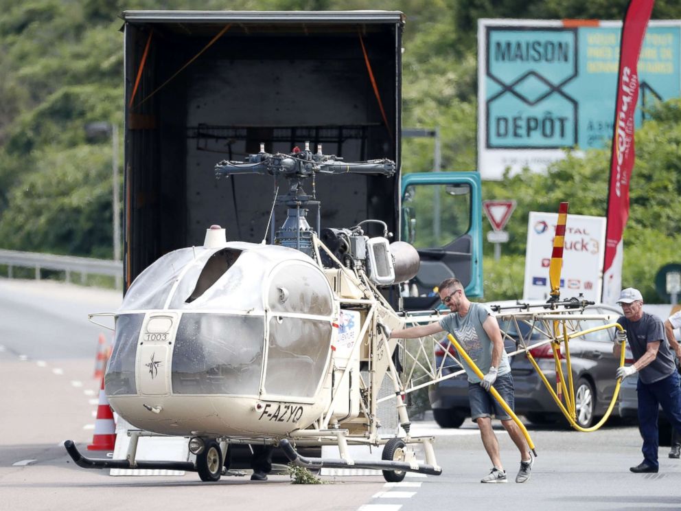 PHOTO: Investigators trasnport an 
Alouette II helicopter allegedly abandoned by French prisoner Redoine Faid and suspected accomplices after his escape from the prison of Reau, in Gonesse, north of Paris, July 1, 
2018.