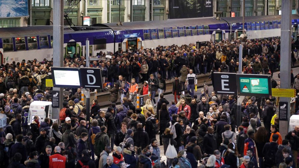Passengers and commuters wait at rush hour at Gare de Lyon train station, in Paris as union stage a mass strike, April 3, 2018.