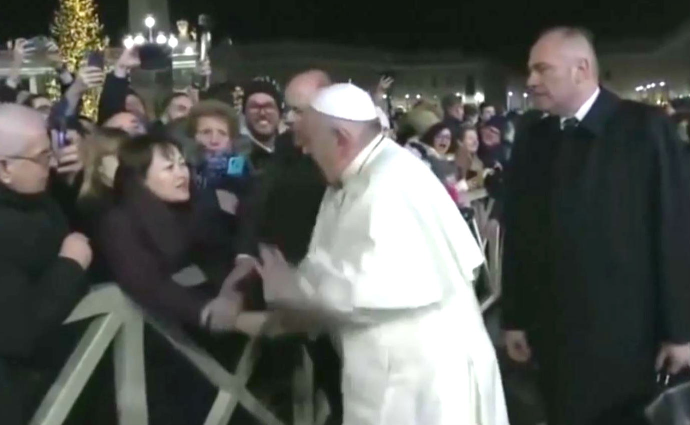 PHOTO: In this still frame from a video, Pope Francis slaps the hand of a woman to free himself after she forcibly grabbed the pontiff and pulled him toward her during a New Year's Eve event in St. Peter’s Square, Dec. 31, 2019.