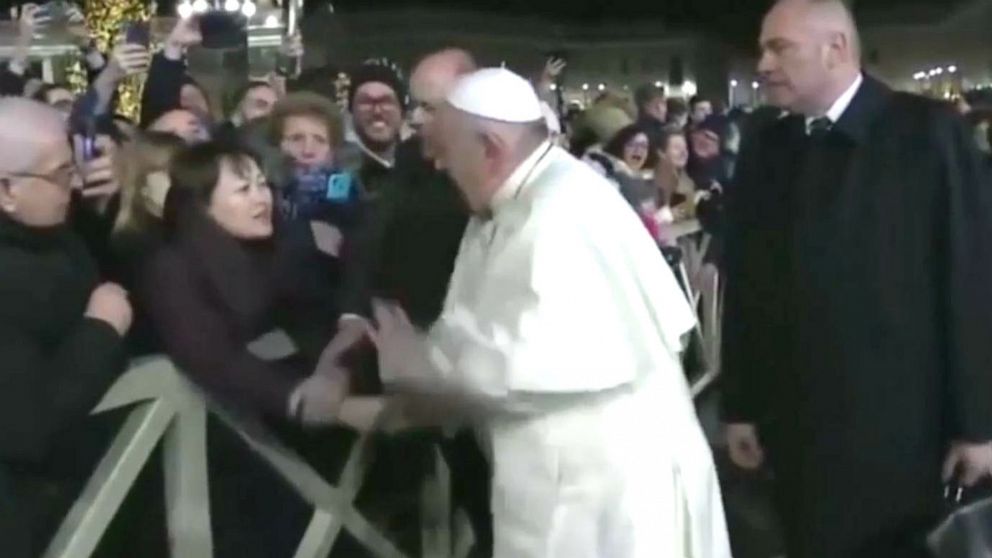 PHOTO: In this still frame from a video, Pope Francis slaps the hand of a woman to free himself after she forcibly grabbed the pontiff and pulled him toward her during a New Year's Eve event in St. Peter’s Square, Dec. 31, 2019.