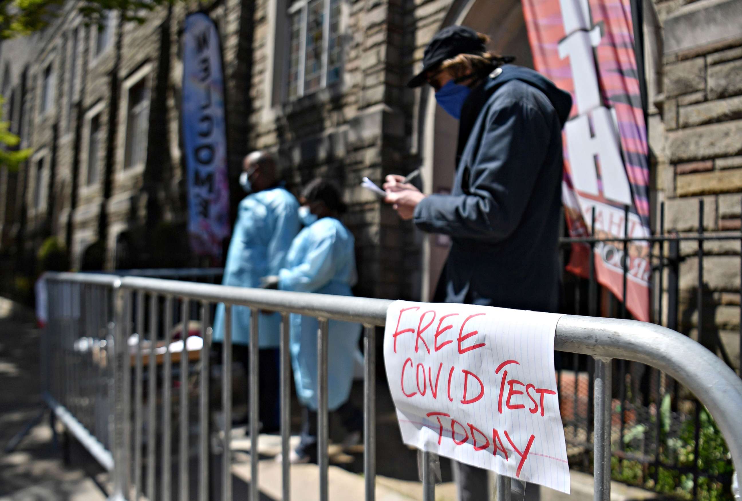 PHOTO: A resident fills out paperwork for a free COVID-19 test at the Bethany Baptist Church in Brooklyn, New York, May 13, 2020.