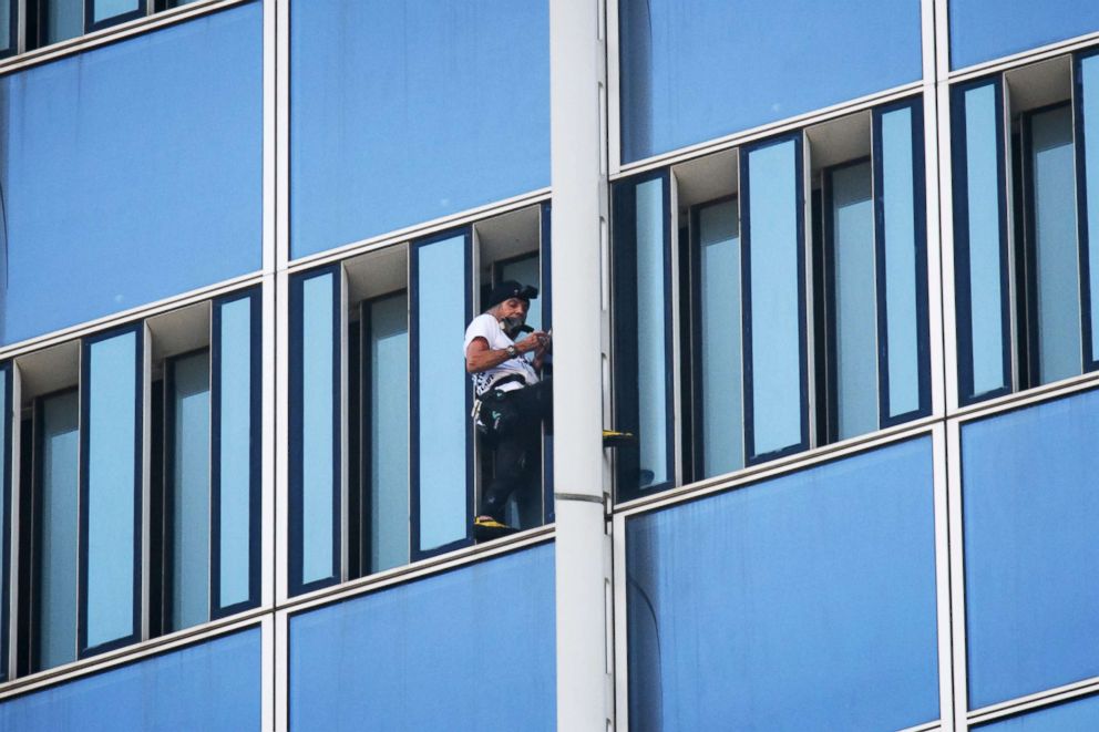 PHOTO: Urban climber Alain Robert of France scales the exterior of the Lotte World Tower in Seoul, June 6, 2018.