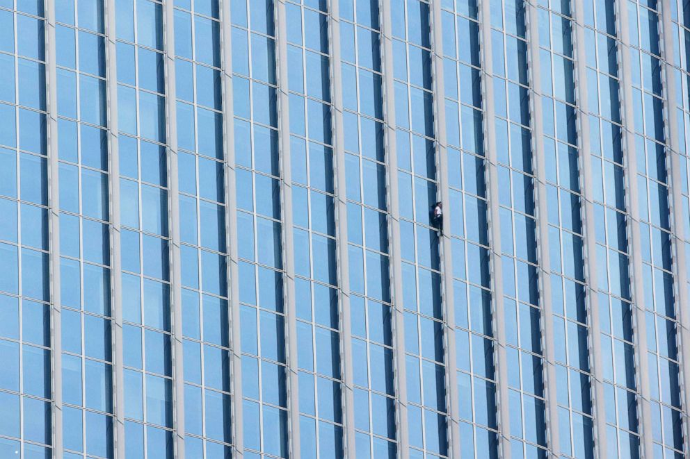 PHOTO: Urban climber Alain Robert of France scales the exterior of the Lotte World Tower in Seoul, June 6, 2018.