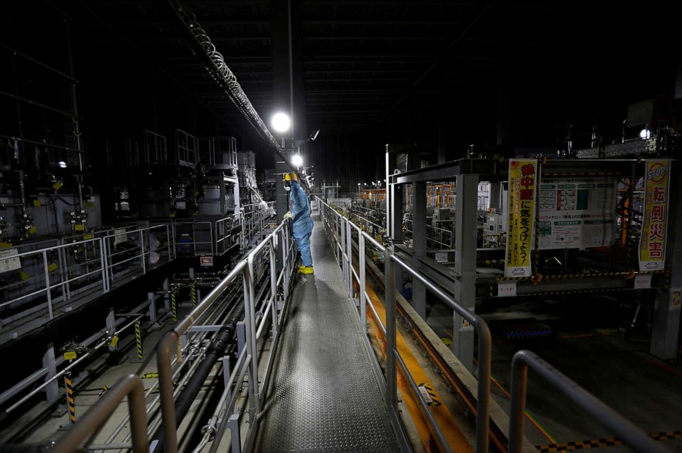 PHOTO: In this Feb. 18, 2019, file photo, an employee of Tokyo Electric Power Co (TEPCO) is shown wearing a protective suit and mask inside a radiation filtering Advanced Liquid Processing Systems at tsunami-crippled Fukushima Daiichi nuclear power plant.