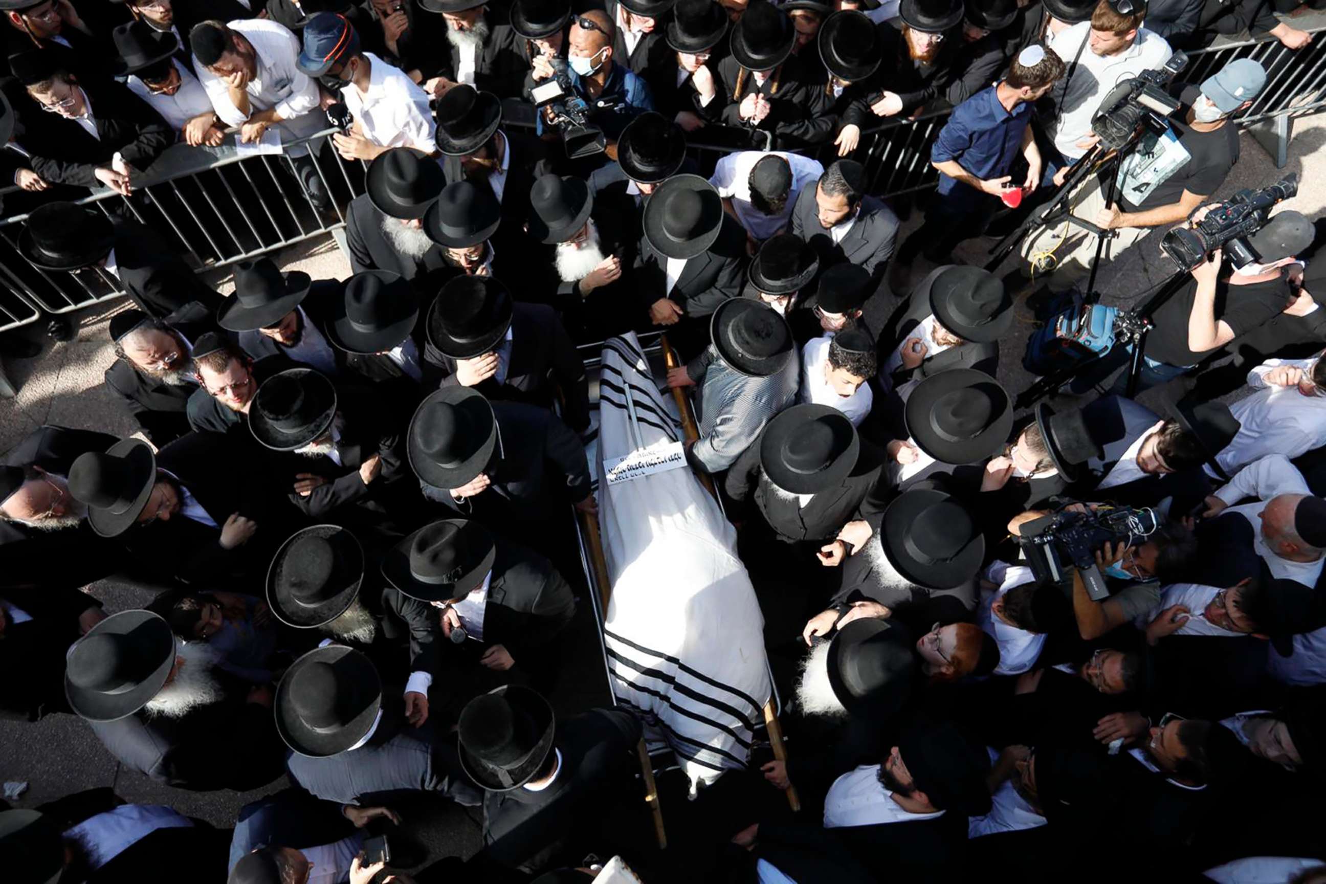 PHOTO: Mourners carry the body of Rabbi Eliezer Goldberg, who died in the stampeded during religious celebrations at Mt. Meron in northern Israel, at his funeral in Jerusalem, April 30, 2021.