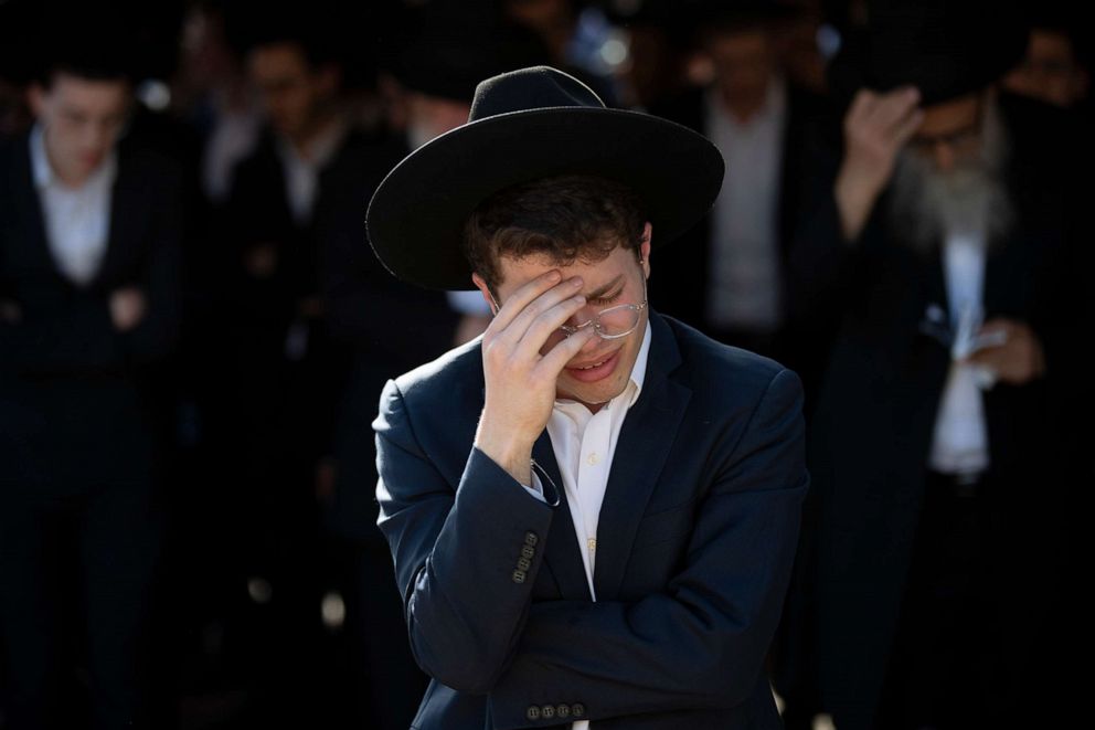 PHOTO: Ultra-Orthodox Jews mourn during the funeral of Moshe Ben Shalom at a cemetery in Petah Tikva, Israel, April 30, 2021. Shalom died in a stampede at a religious festival in Mt. Meron, northern Israel.