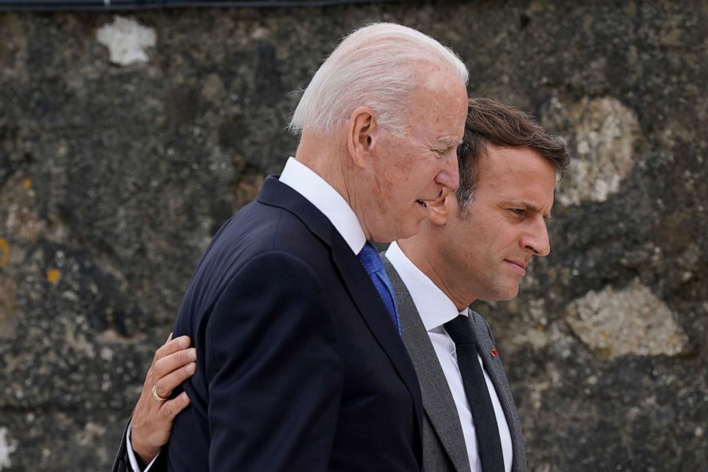 PHOTO: President Joe Biden speaks with French President Emmanuel Macron after posing for the G-7 family photo with guests at the G-7 summit, June 11, 2021, in Carbis Bay, England.
