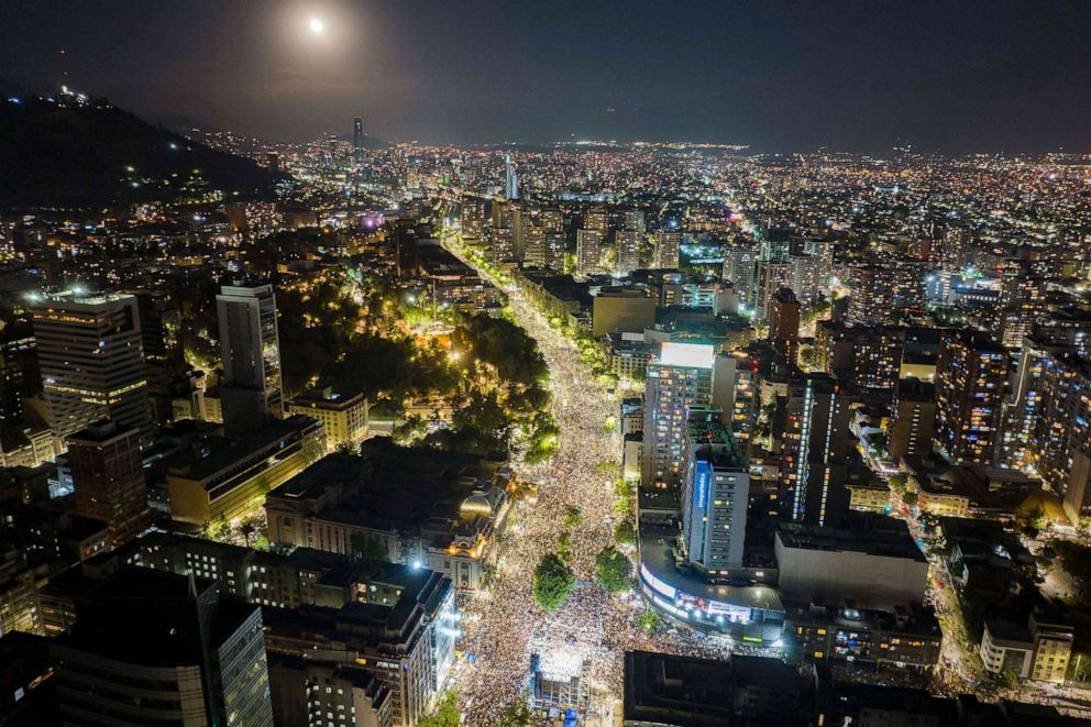 PHOTO: An aerial view shows supporters of Chilean president-elect Gabriel Boric celebrating in the streets of Santiago, Dec. 19, 2021, following the official results of the runoff presidential election.