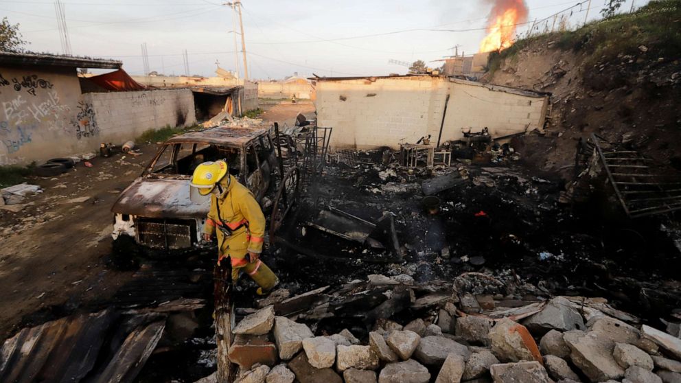 PHOTO: A firefighter walks at an area affected by the explosion of a gas leak caused by a pipeline theft, in the San Pablo Xochimehuacan neighborhood in Puebla, Mexico October 31, 2021. 