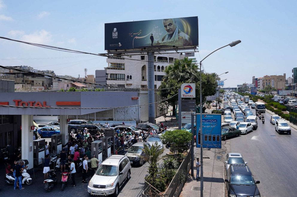 PHOTO: In this June 27, 2021, file photo, drivers wait in a long line to get fuel at a gas station along the airport highway, in the southern suburbs of Beirut, Lebanon.