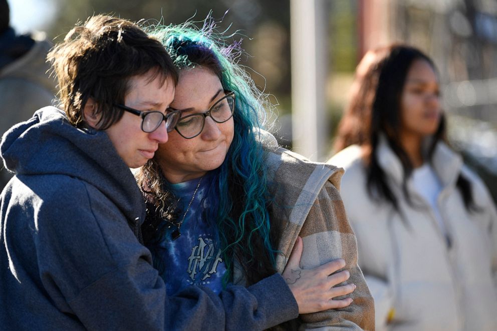 PHOTO: Jessy Smith Cruz hugs Jadzia Dax McClendon the morning after a mass shooting at Club Q, an LGBTQ nightclub in Colorado Springs, Colorado on November 20, 2022.