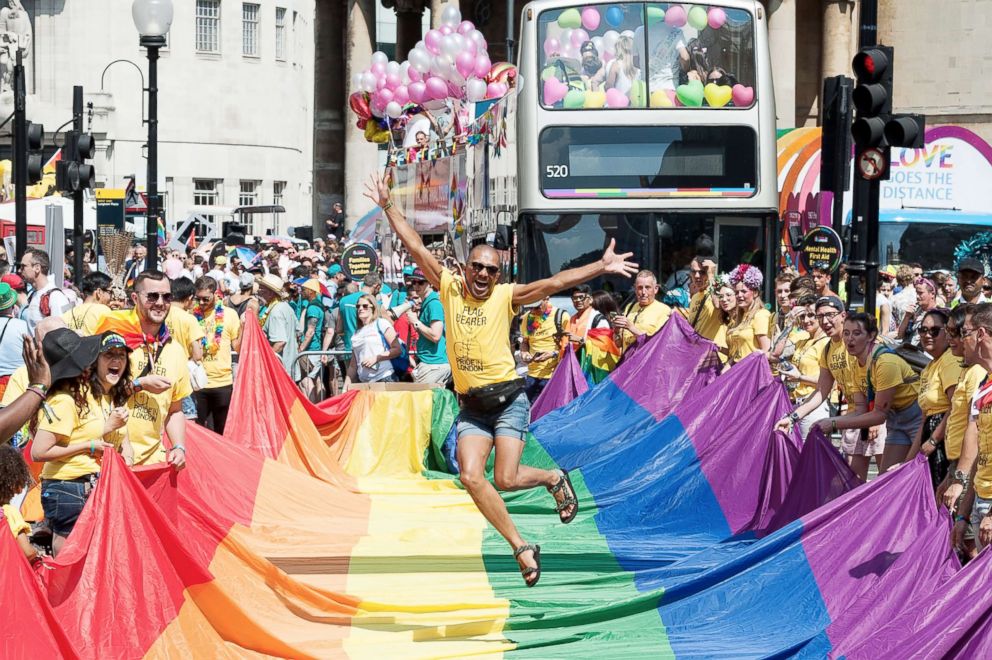 PHOTO: Flag bearers gather for the Pride in London parade in London, July 07, 2018.