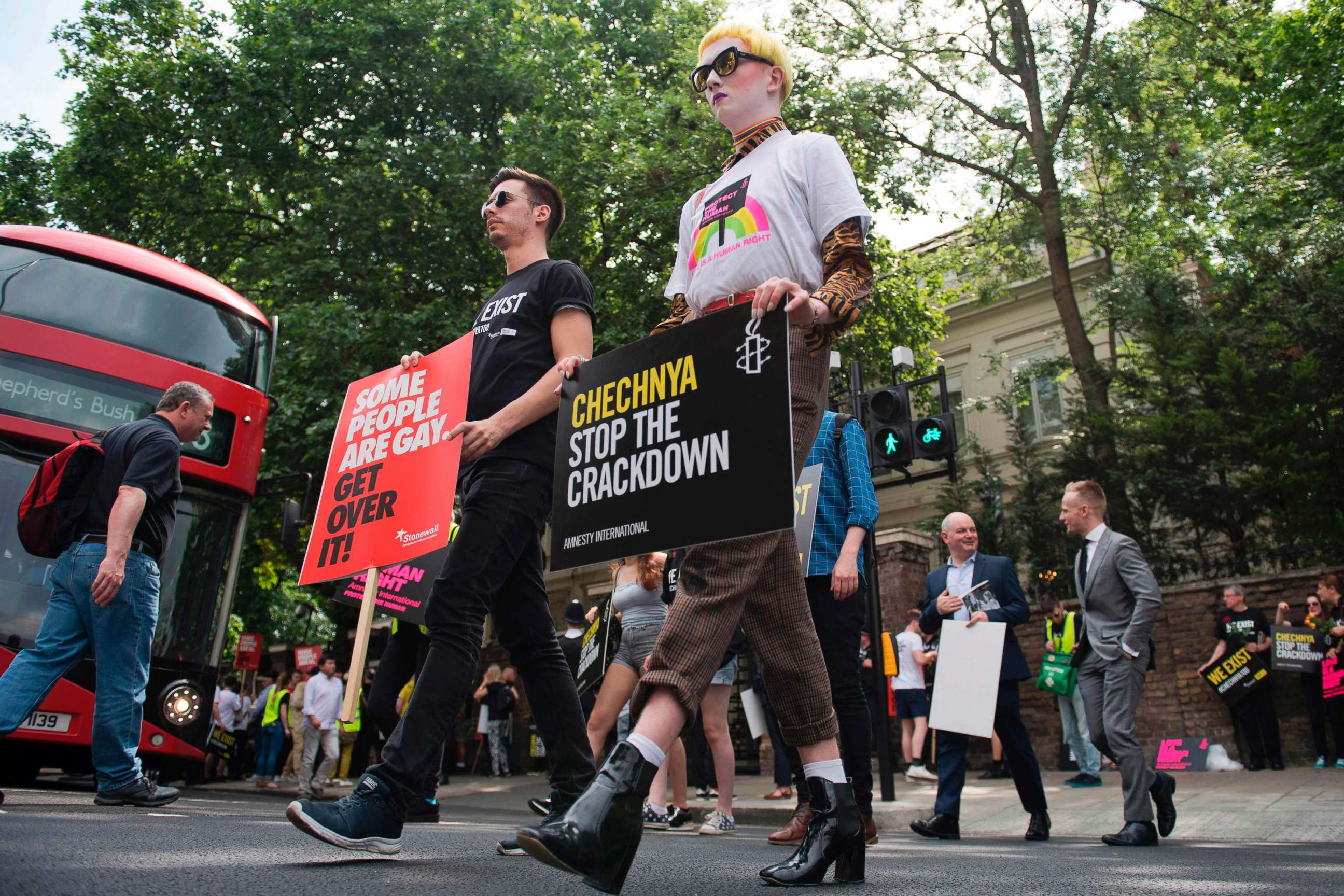 PHOTO: Demonstrators carry placards as they protest over an alleged crackdown on gay men in Chechnya outside the Russian Embassy, in London, June 2, 2017. 