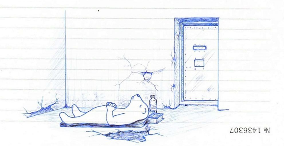 PHOTO: Gaylen lying on the cold prison floor.