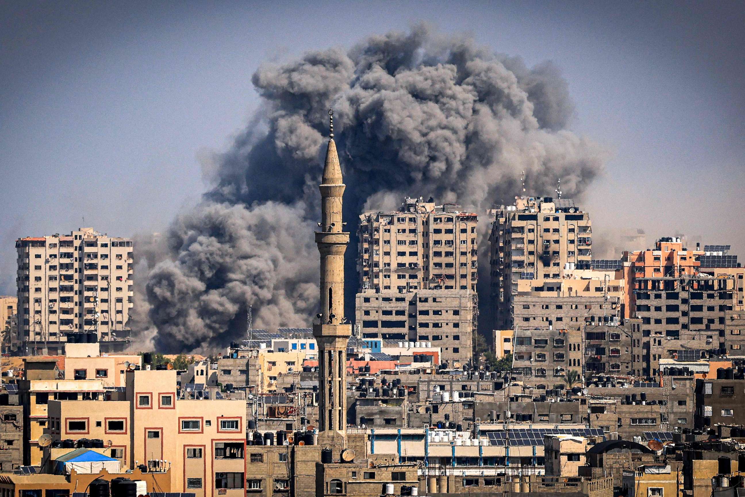 Smoke plumes billow during Israeli air strikes in Gaza City on Oct. 12, 2023, as raging battles between Israel and the Hamas movement continue for the sixth consecutive day.