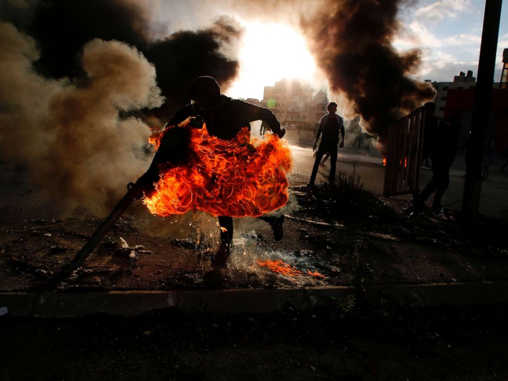 PHOTO: A Palestinian protester runs after catching fire during clashes with Israeli troops at a protest near the Jewish settlement of Beit El, near the West Bank city of Ramallah, Dec. 7, 2017.