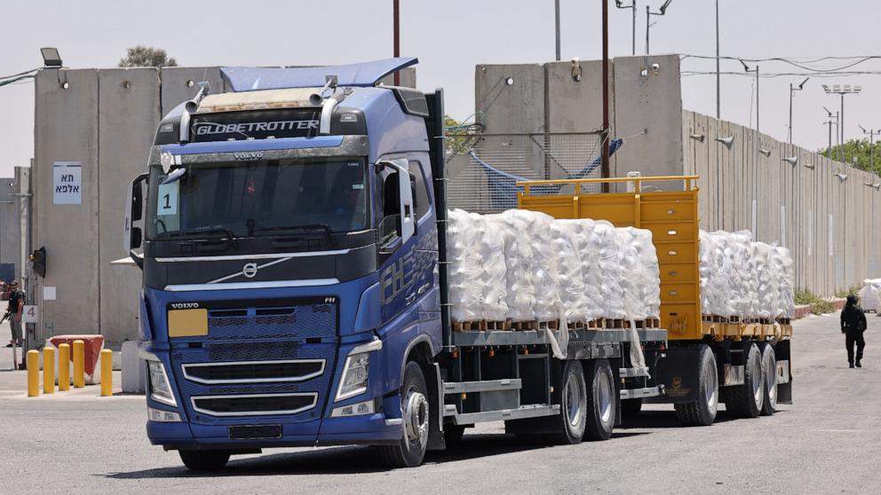 PHOTO: A truck carrying humanitarian aid for the Gaza Strip drives at the Kerem Shalom border crossing between southern Israel and Gaza, on May 30, 2024.