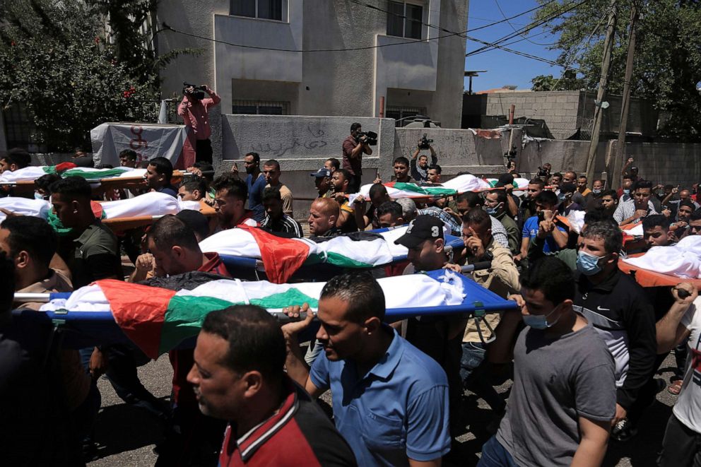 PHOTO: Palestinians carry the bodies of children killed in an Israeli airstrike in Gaza City, Gaza Strip, on May 15, 2021.