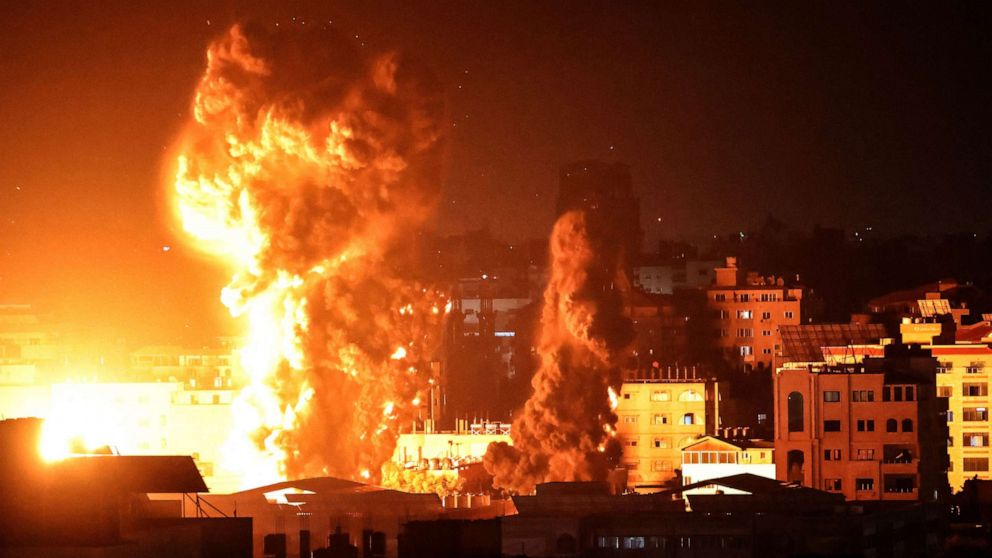 PHOTO: Fire and smoke rise above buildings in Gaza City as Israeli warplanes target the Palestinian enclave, May 17, 2021.
