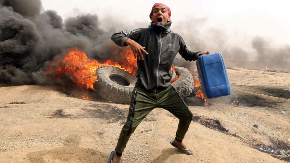 A demonstrator shouts during clashes with Israeli troops at a protest at the Israel-Gaza border where Palestinians demand the right to return to their homeland, east of Gaza City, April 20, 2018.