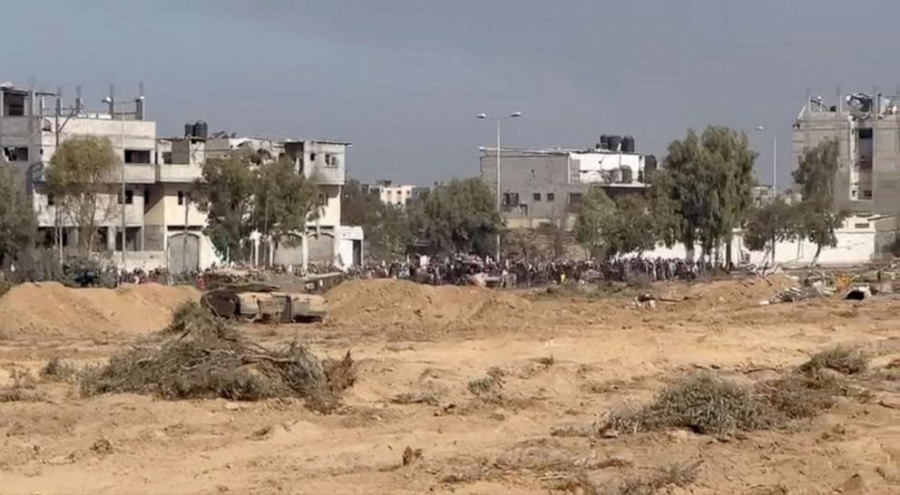 PHOTO:A still image taken from a video shows what the Israeli army says are Palestinians holding white flags as they walk from north Gaza to the south near an Israeli tank in a location given as Gaza, obtained by Reuters on Nov. 7, 2023.