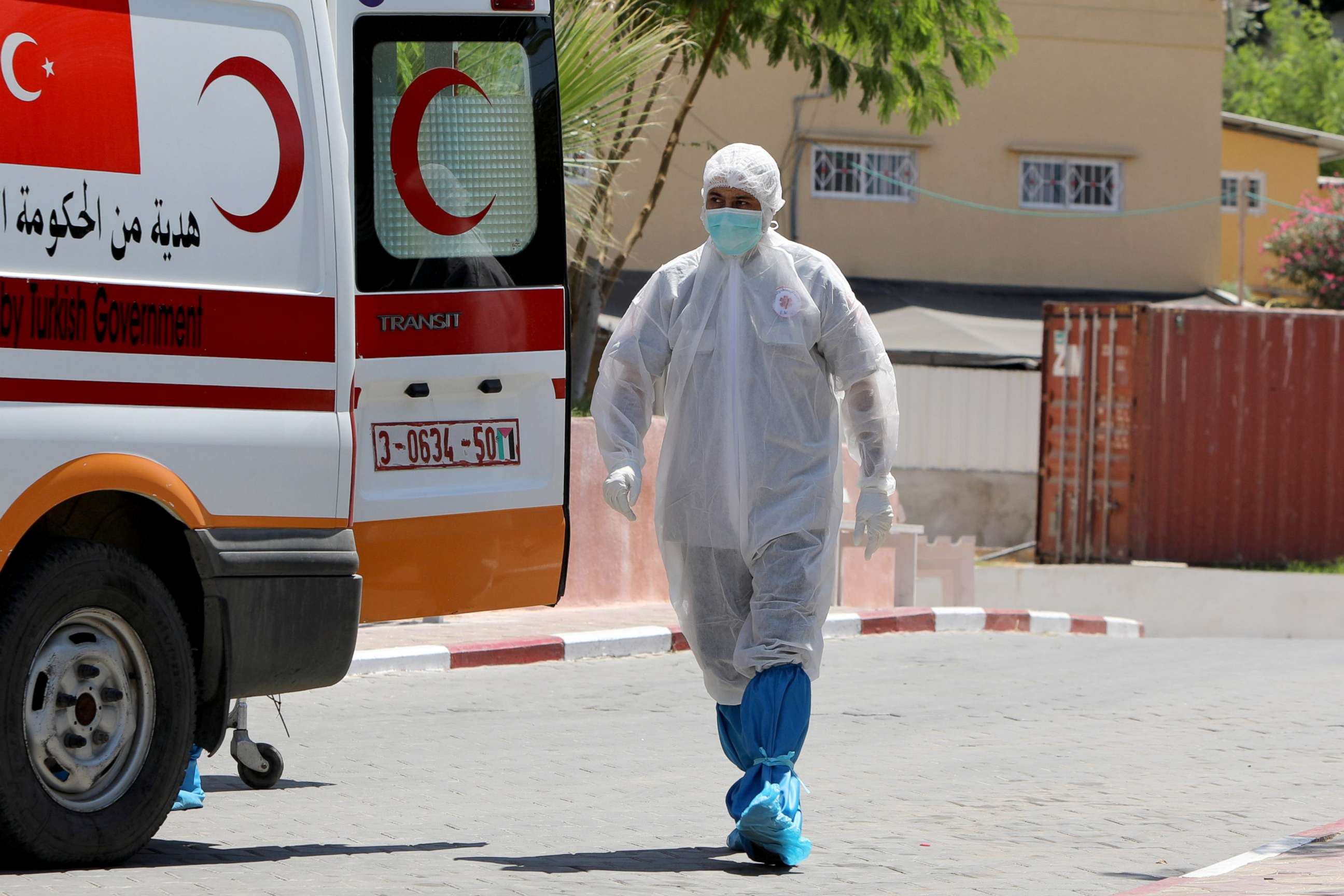 PHOTO: A Palestinian health worker outside a hospital where a 61-year-old man died after contracting COVID-19, in the northern Gaza Strip, Aug. 26, 2020.