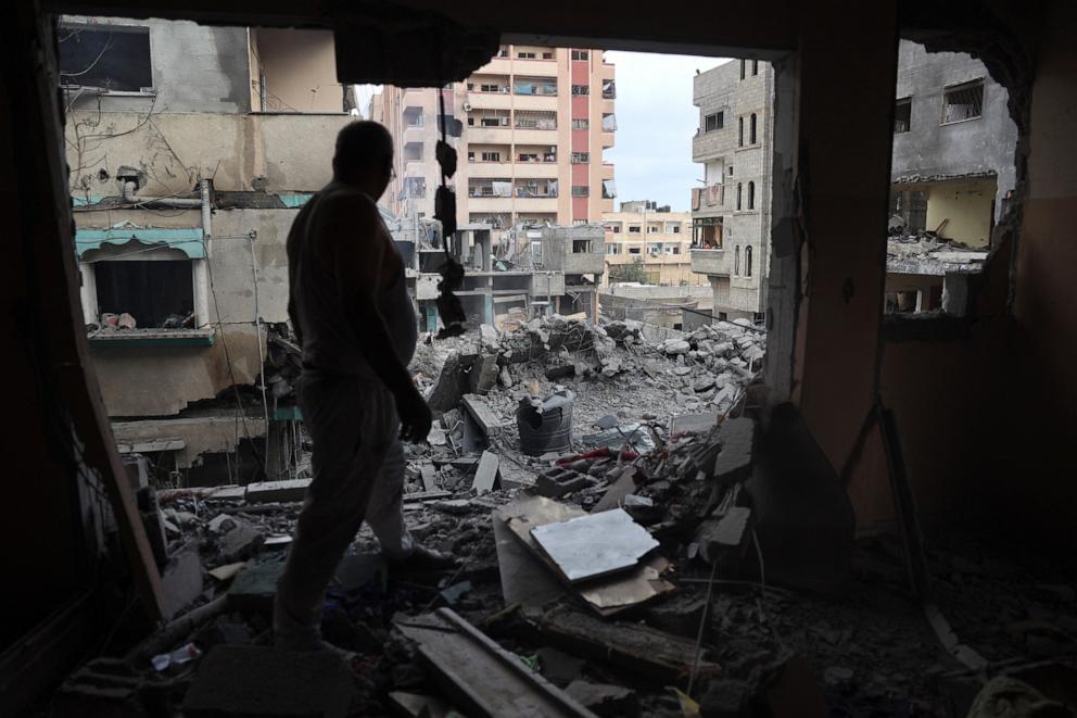 PHOTO: A Palestinian man inspects the damage a day after an operation by the Israeli Special Forces in the Nuseirat camp, in the central Gaza Strip on June 9, 2024.