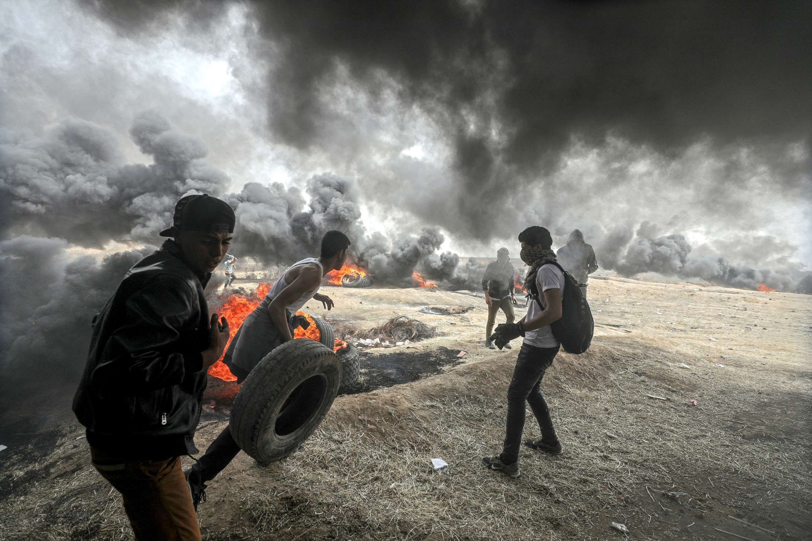 PHOTO: Palestinians protesters are pictured during clashes near the border with Israel in the east of Gaza City, April 20, 2018. 