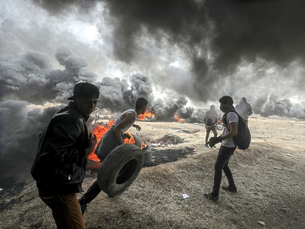 PHOTO: Palestinians protesters are pictured during clashes near the border with Israel in the east of Gaza City, April 20, 2018.