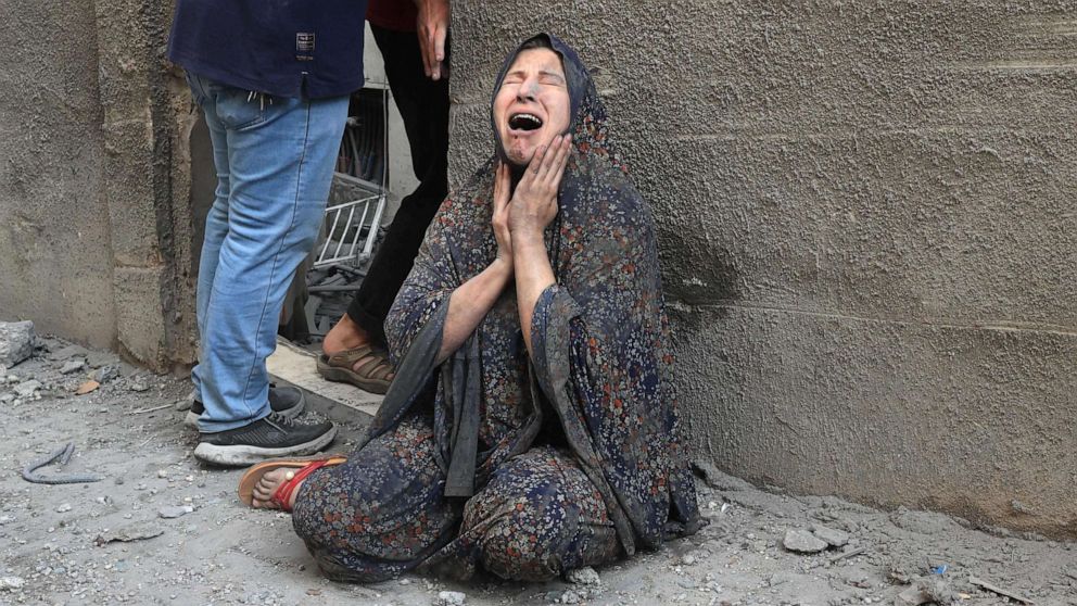 PHOTO: A Palestinian woman reacts after an Israeli airstrike on the Rafah refugee camp, in the southern Gaza Strip on October 17, 2023.