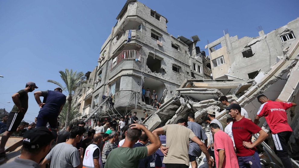 PHOTO: Palestinian emergency services and local citizens search for victims in buildings destroyed during Israeli air raids in the southern Gaza Strip on Oct. 24, 2023 in Khan Yunis, Gaza.