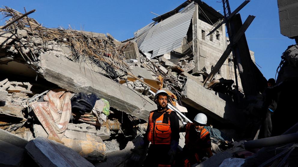 PHOTO: Palestinians inspect the damage at the site of Israeli strikes on houses, amid the ongoing conflict between Israel and the Palestinian Islamist group Hamas, in Khan Younis in the southern Gaza Strip, Dec. 10, 2023. 