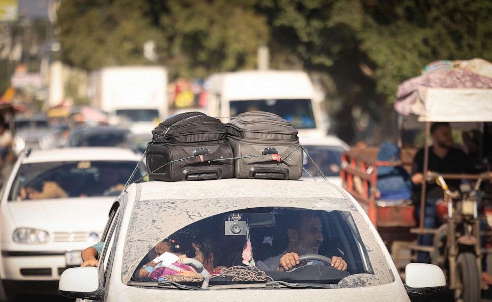 PHOTO: Palestinians with their belongings flee northern Gaza City following the Israeli army's warning to leave their homes before an expected ground offensive, in Gaza City on Oct. 13, 2023.