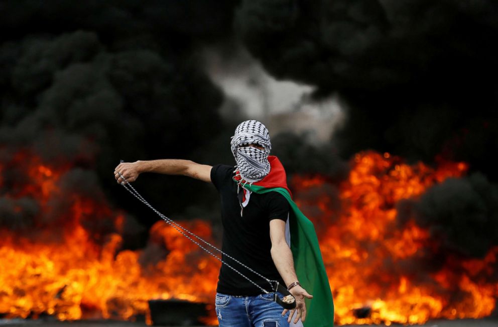 PHOTO: A Palestinian demonstrator holds a sling during a protest marking the 70th anniversary of Nakba, near the Jewish settlement of Beit El, near Ramallah, in the occupied West Bank on May 15, 2018.